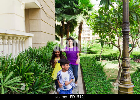 indian mother with children  park running Stock Photo