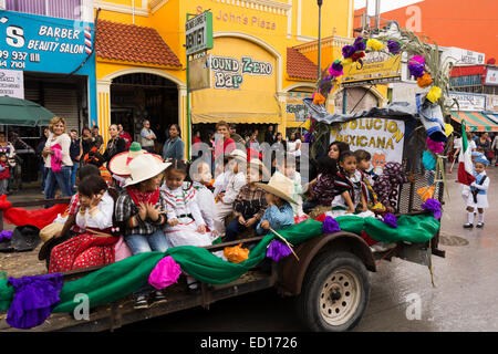 Children ride on a parade trailer in Nuevo Progreso to celebrate Mexican Independence Day. Stock Photo