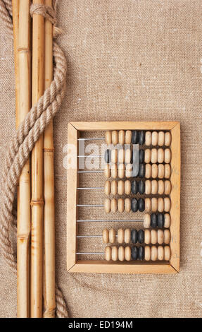 old wooden abacus on the background of bagging Stock Photo