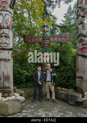 Totem poles vertical, Capilano Park, Vancouver, British Columbia, Canada Stock Photo