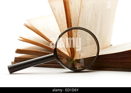 Magnifying glass and book isolated on white Stock Photo
