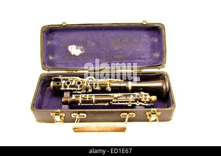 black antique clarinet musical instrument in old grunge case isolated on white Stock Photo