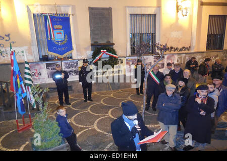 Naples, Italy. 23rd Dec, 2014. Local residents and family of the late victims paying homage of 'Train 904 Bombing' with the support of the City of Casoria represented by Mayor Vincenzo Carfora. The Train 904 bombing, also known as the Christmas Massacre, was a terror attack which occurred on December 23, 1984, in the Apennine Base Tunnel. A bomb on the 904 express train (Rapido 904) from Naples to Milan was detonated, killing 17 and wounding 267. Credit:  Salvatore Esposito/Pacific Press/Alamy Live News Stock Photo