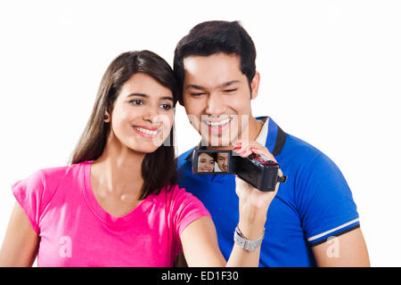2 indian Beautiful Couple  Video Camera Recording Stock Photo