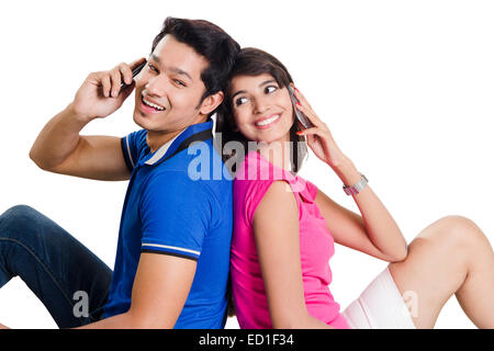 2 indian Beautiful Couple talking phone Stock Photo