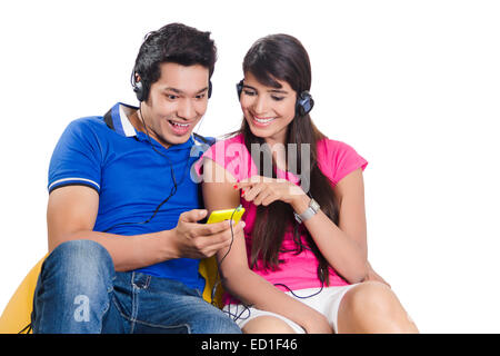 2  indian Beautiful Couple Phone Hearing Music Stock Photo