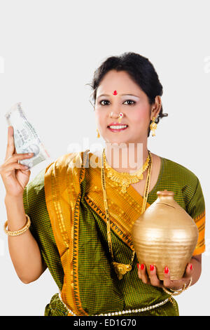 1 South indian Lady saving money Piggy Bank Stock Photo - Alamy