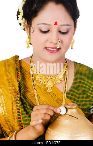 1 South  indian Lady saving money Piggy Bank Stock Photo