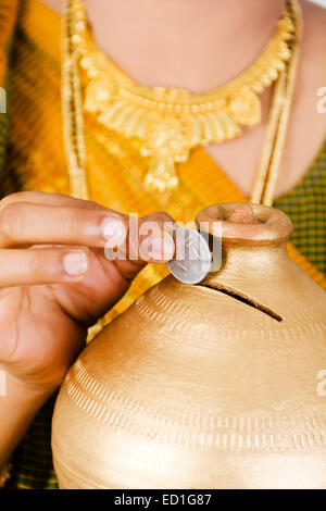 1 South indian Lady saving money Piggy Bank Stock Photo - Alamy