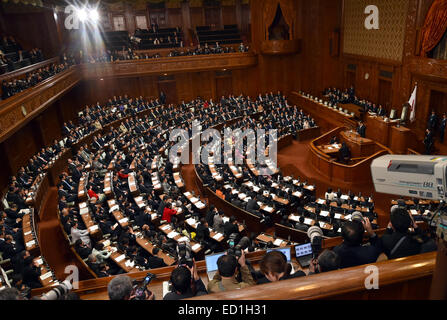 Tokyo, Japan. 24th Dec, 2014. Nobutaka Machimura, on the podium, of the Liberal Democratic Party delivers his message after being elected speaker of the lower house during a special Diet session convened in Tokyo on Wednesday, December 24, 2014. Credit:  Natsuki Sakai/AFLO/Alamy Live News Stock Photo