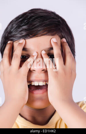 1 indian child boy Covering face Stock Photo