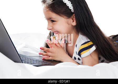 1 indian beautiful child watching Laptop Stock Photo
