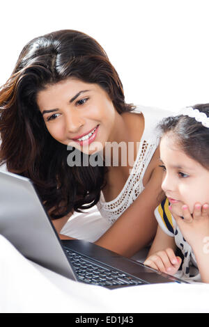 indian mother with child enjoy Watching laptop Stock Photo