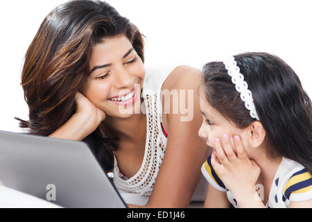 indian mother with child enjoy Watching laptop Stock Photo