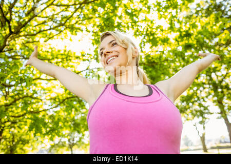 Fit blonde stretching in the park Stock Photo