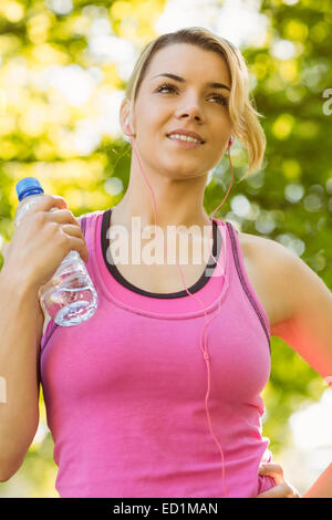 Fit blonde holding her water bottle Stock Photo - Alamy