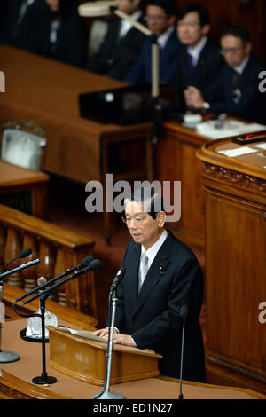 Tokyo, Japan. 24th Dec, 2014. Nobutaka Machimura delivers a speech after being elected as speaker of the lower house in Tokyo, Japan, Dec. 24, 2014. The lower house of Japan elected former foreign minister Nobutaka Machimura as its speaker, replacing Bunmei Ibuki. Credit:  Ma Ping/Xinhua/Alamy Live News Stock Photo