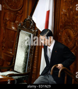 Tokyo, Japan. 24th Dec, 2014. Nobutaka Machimura walks to his seat after being elected as speaker of the lower house in Tokyo, Japan, Dec. 24, 2014. The lower house of Japan elected former foreign minister Nobutaka Machimura as its speaker, replacing Bunmei Ibuki. Credit:  Ma Ping/Xinhua/Alamy Live News Stock Photo