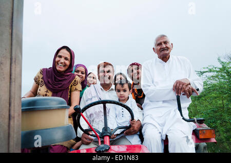 indian Farmer Family riding Tractor Stock Photo