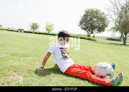 1 indians Child boy park playing  Football Stock Photo