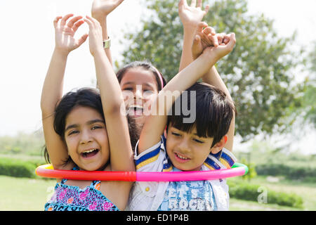 indians Children  park playing Hulahoop Stock Photo
