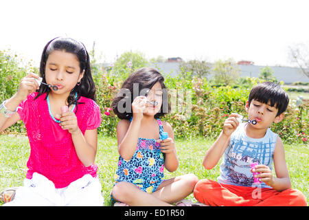 indians children park playing  Bubble Wand Stock Photo