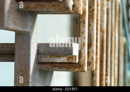 Metal staircase with stone steps and rust Stock Photo