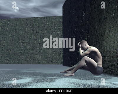 Young man sitting alone in the street against a wall feeling sad by full moon light Stock Photo