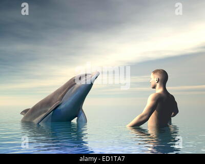 Man in front of a dolphin into the ocean by cloudy weather Stock Photo