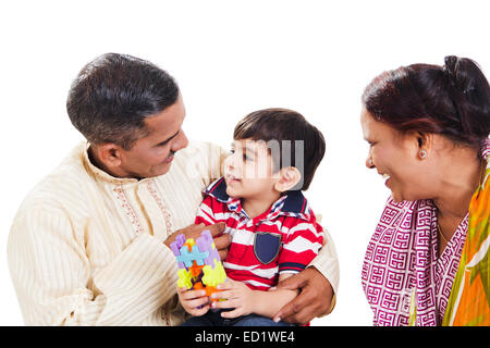 indian Parents and grandson playing toy Stock Photo