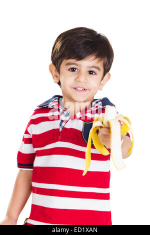 1 indian child boy Eating Fruit Stock Photo