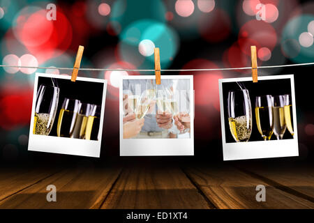 Composite image of hands toasting with champagne Stock Photo