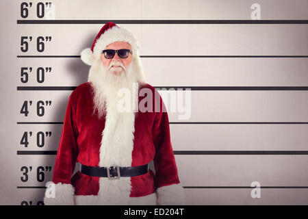 Composite image of santa claus wears black sunglasses Stock Photo