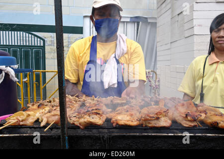 Thai chicken barbecue offered by vendor. Thai street market, Bangkok, South-east Asia Thailand. Stock Photo