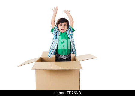 1 indian child boy playing Carton Box Stock Photo