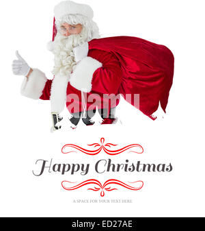 Composite image of positive santa with his sack and thumbs up Stock ...