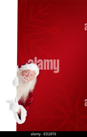 Composite image of santa claus showing blackboard Stock Photo - Alamy
