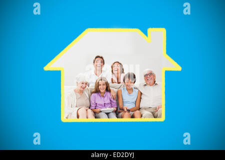 Composite image of multigeneration family on couch watching tv Stock Photo