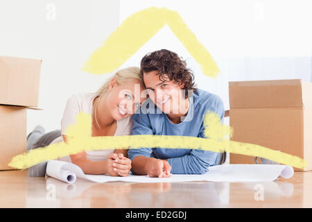 Composite image of couple organizing their future home Stock Photo