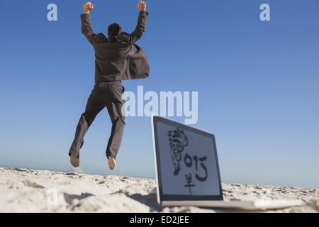 Composite image of victorious businessman jumping leaving his laptop Stock Photo