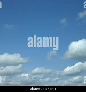 Puffy Clouds in Blue Sky Stock Photo