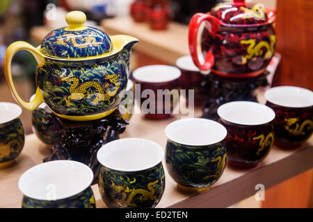 Chinese tea sets, painted decorative teapots and cups on display at a store in Shanghai, China Stock Photo