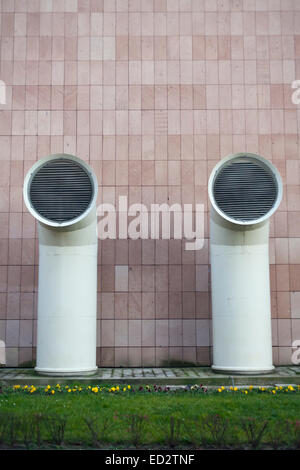 industrial wall background with two big ventilation pipes Stock Photo