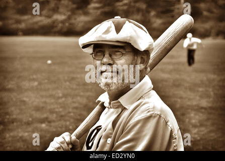 Vintage Base Ball player posing with a bat during a 1850s base ball game in Wisconsin Stock Photo