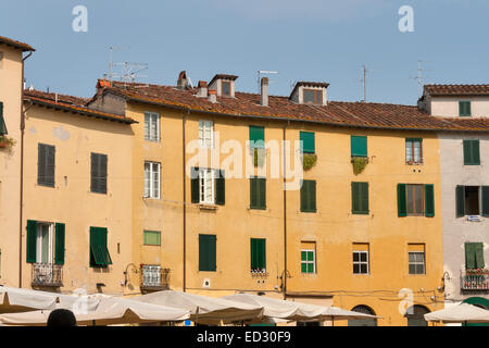 Residential buildings on oval Amphitheater Square in Lucca, Tuscany, Italy Stock Photo