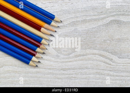 Pencil tips lined up on rustic white wood Stock Photo