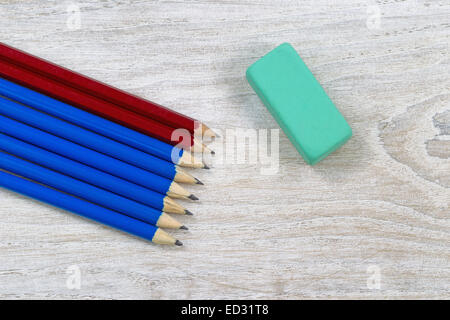 Pencil tips; sharpen, with single large eraser on rustic white wood Stock Photo