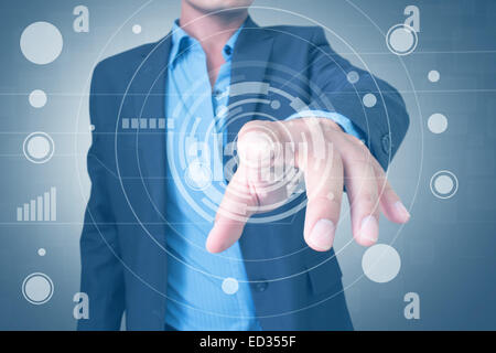 Man Pressing Futuristic Screen Interface Stock Photo