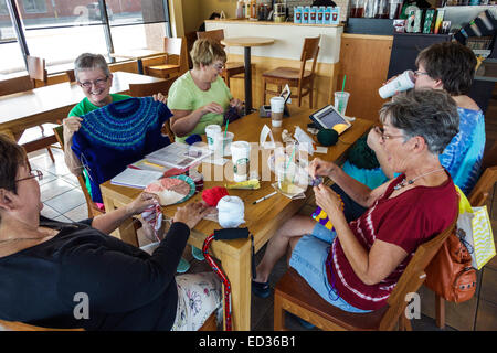 Springfield Illinois,Starbucks Coffee,barista,cafe,interior inside,adult adults woman women female lady,friends,quilting sewing bee,meeting,visitors t Stock Photo