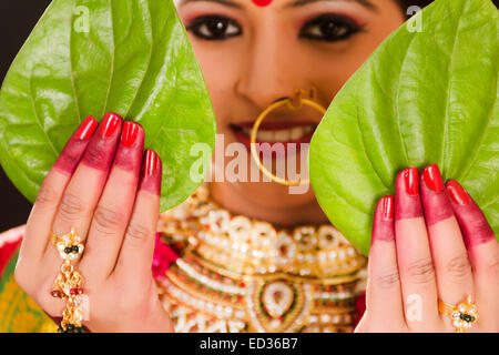 Woman Wearing Traditional Clothing and Mehendi Posing under a Garland ·  Free Stock Photo